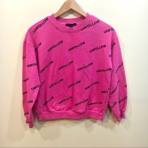 pink unfollow sweatshirt
